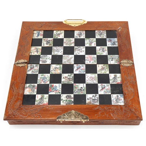 2328 - Chinese hardwood folding chess set, 36cm x 36cm