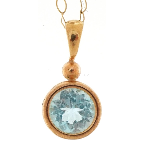 3166 - Unmarked gold blue topaz solitaire pendant on a 9ct gold necklace, the topaz approximately 6.50mm in... 