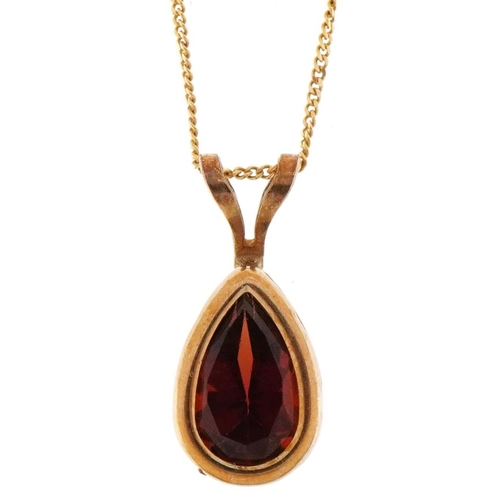 3229 - 9ct gold garnet teardrop pendant on a 9ct gold necklace, 1.3cm high and 40cm in length, total 1.0g