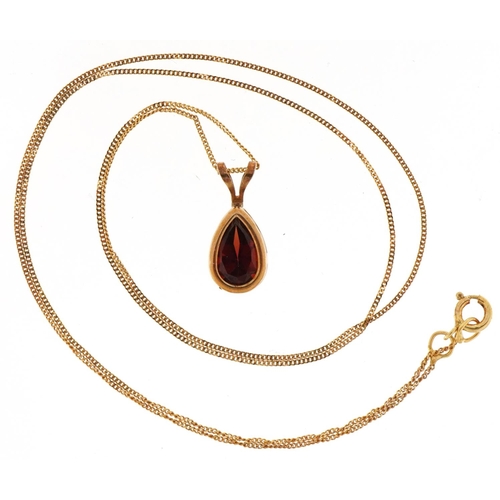 3229 - 9ct gold garnet teardrop pendant on a 9ct gold necklace, 1.3cm high and 40cm in length, total 1.0g