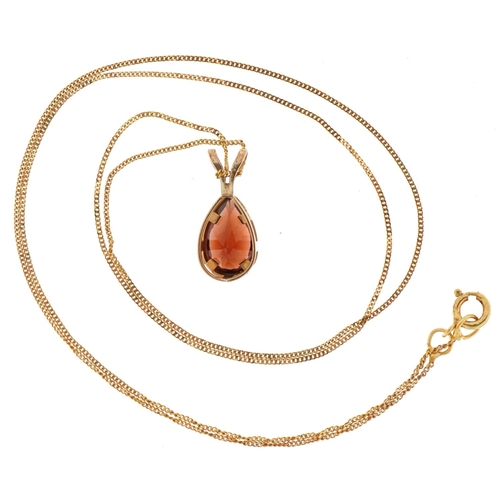 3229 - 9ct gold garnet teardrop pendant on a 9ct gold necklace, 1.3cm high and 40cm in length, total 1.0g