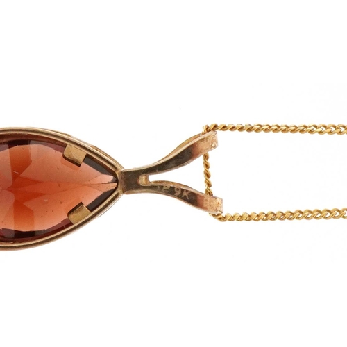 3229 - 9ct gold garnet teardrop pendant on a 9ct gold necklace, 1.3cm high and 40cm in length, total 1.0g