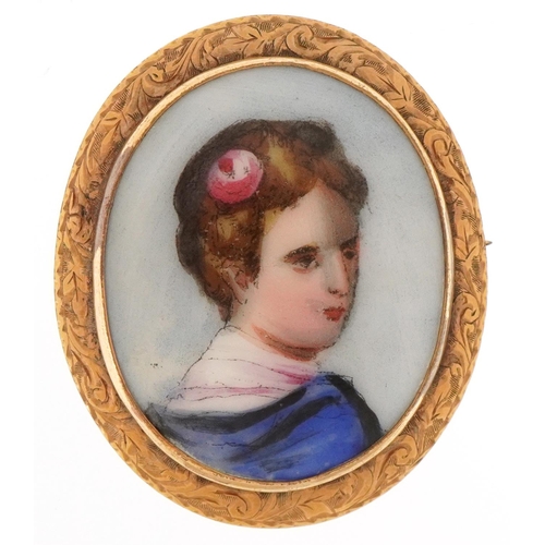 3133 - Portrait miniature porcelain brooch with yellow metal mount hand painted with a female with a flower... 