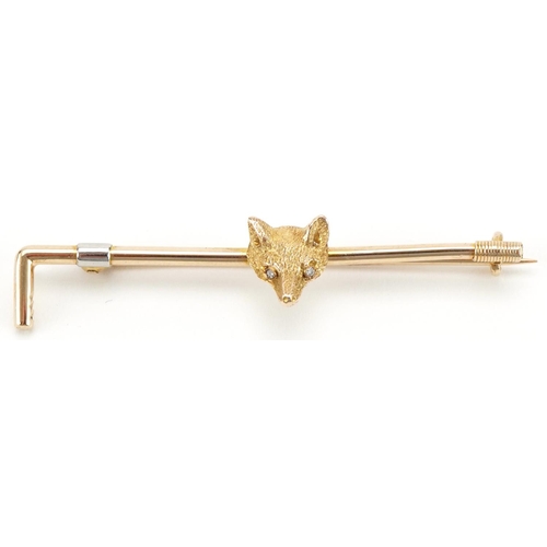 3119 - Hunting interest 9ct gold and platinum brooch in the form of a riding crop and fox head set with dia... 