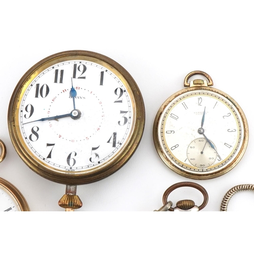 3549 - Four gentlemen's open face pocket watches, one silver and an eight day travel pocket watch, the larg... 