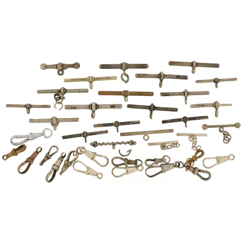 3537 - Large collection of silver, white and yellow metal watch chain T bars and dog clip clasps, total 76.... 