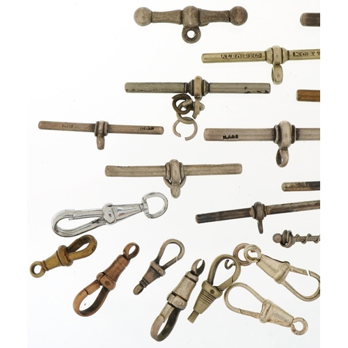 3537 - Large collection of silver, white and yellow metal watch chain T bars and dog clip clasps, total 76.... 