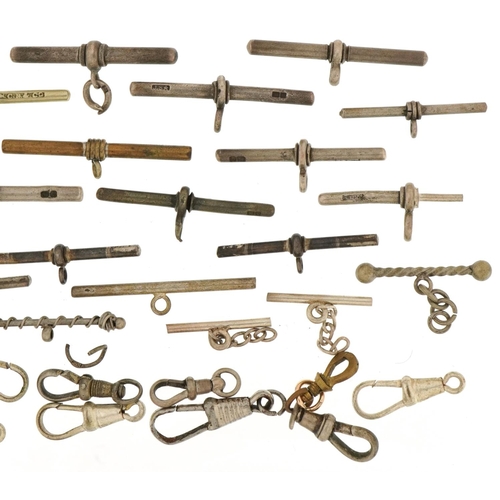 3537 - Large collection of silver, white and yellow metal watch chain T bars and dog clip clasps, total 76.... 