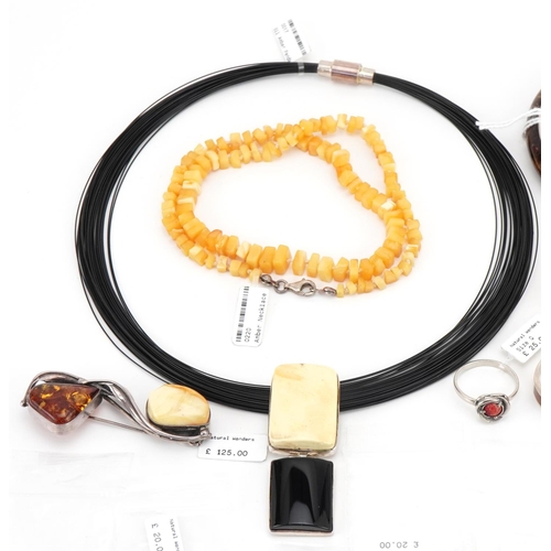 3556 - Large collection of silver and amber jewellery including necklaces, pendants and rings