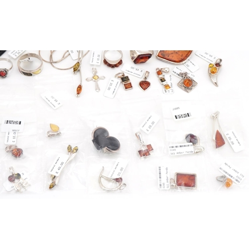 3556 - Large collection of silver and amber jewellery including necklaces, pendants and rings