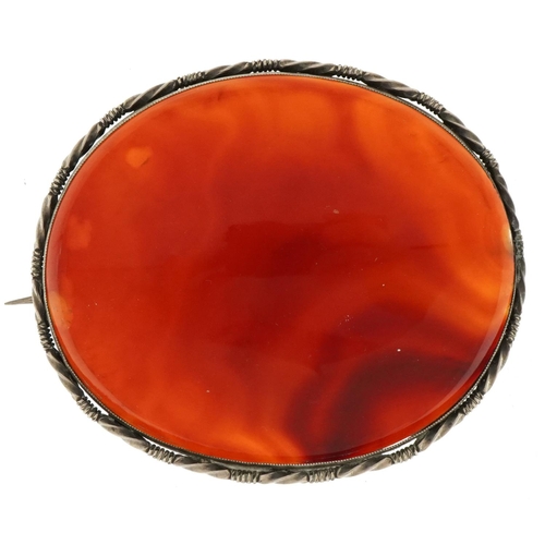 3423 - Large unmarked silver mounted agate brooch, 6.5cm wide, 39.2g