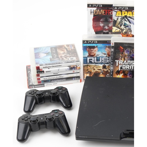 2375 - Sony PlayStation 3 games console with controllers and a collection of games