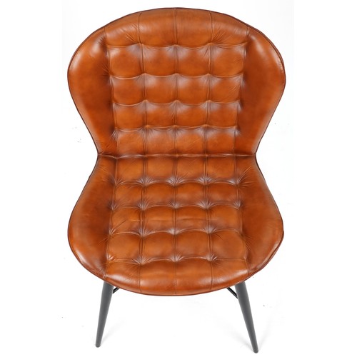 710 - Modern buttoned tan brown leather chair on black painted legs, 90cm H x 58cm W x 55cm D