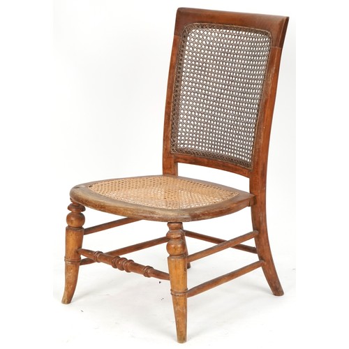 694 - Early 20th century beech framed nursing chair with cane seat and back, 73cm H x 44cm W x 49cm D