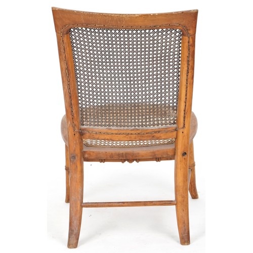 694 - Early 20th century beech framed nursing chair with cane seat and back, 73cm H x 44cm W x 49cm D