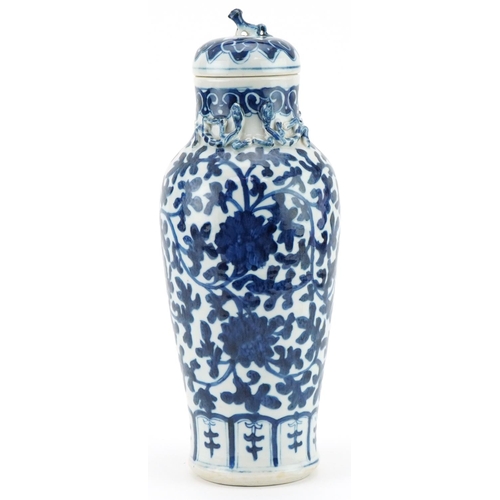 1201 - Chinese porcelain vase and cover hand painted in a floral pattern, 35cm high