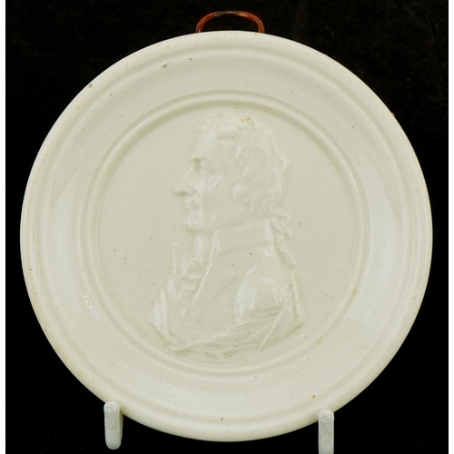 1095 - Early 19th century creamware commemorative plaque for Lord Nelson, 9cm in diameter