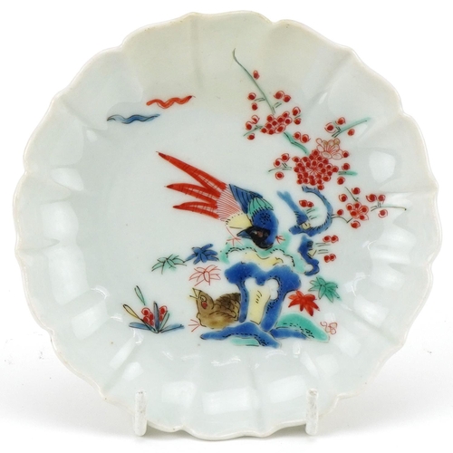 1203 - Japanese porcelain dish hand painted in the floral kakiemon palette, 12cm in diameter