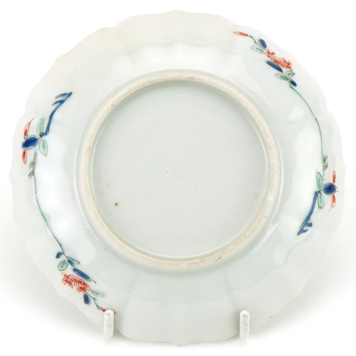 1203 - Japanese porcelain dish hand painted in the floral kakiemon palette, 12cm in diameter