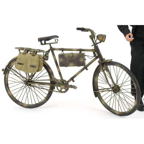 2573 - German military interest; figure on a bicycle with working headlight and holding a rifle, overall 30... 