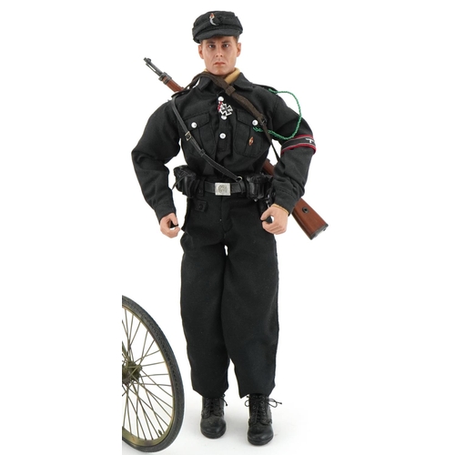 2573 - German military interest; figure on a bicycle with working headlight and holding a rifle, overall 30... 