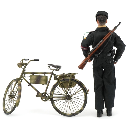 2573 - German military interest; figure on a bicycle with working headlight and holding a rifle, overall 30... 