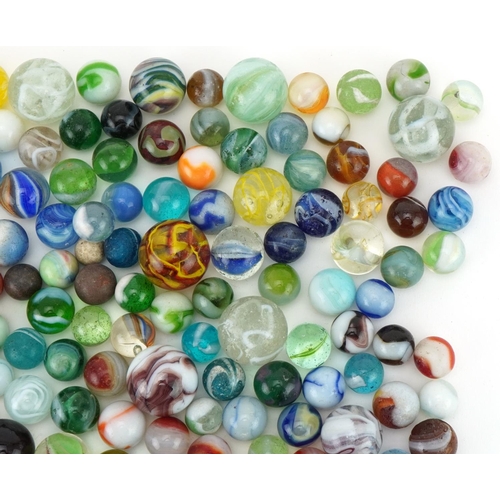 2314 - Collection of 19th century and later glass marbles, the largest 25mm in diameter