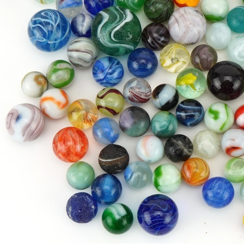 2314 - Collection of 19th century and later glass marbles, the largest 25mm in diameter