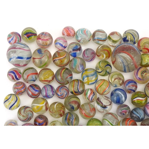 2313 - Good collection of 19th century glass marbles, including Latticino, the largest 30mm in diameter