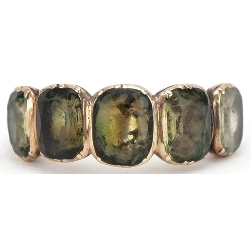 3144 - Antique yellow metal ring set with five green stones, size J, 2.4g