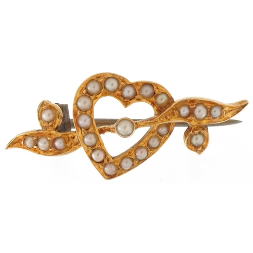 3392 - Unmarked gold seed pearl brooch in the form of a love heart, 2.5cm wide, 2.1g