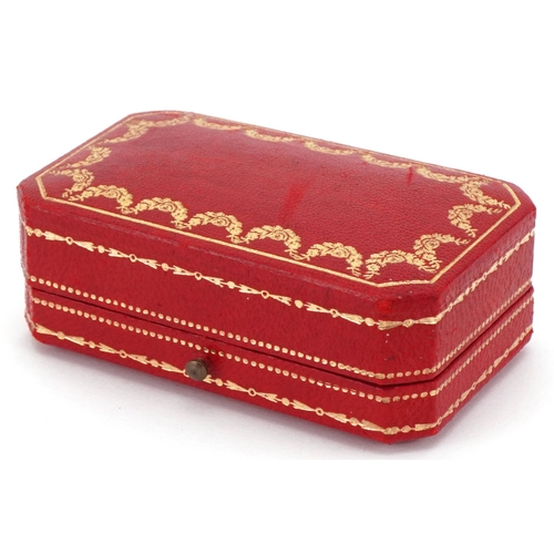 3576 - Cartier, tooled red leather cufflink box, 8cm wide