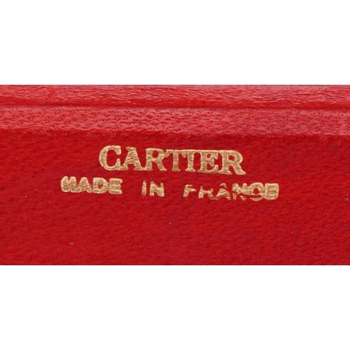 3576 - Cartier, tooled red leather cufflink box, 8cm wide