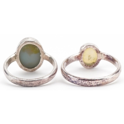 3367 - Two silver Australian opal rings, sizes G and O, total 4.9g