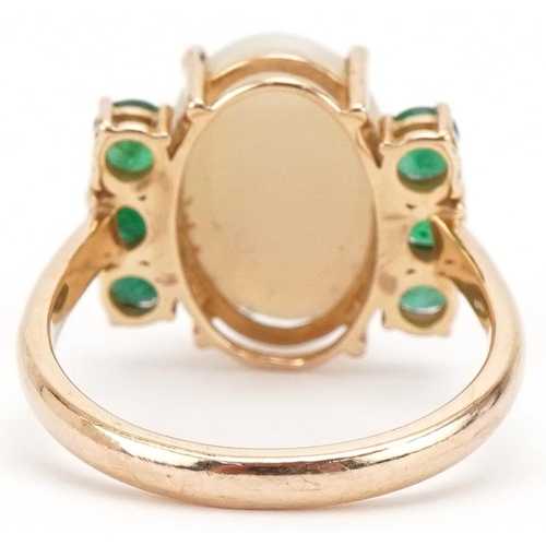 3284 - 9ct gold cabochon opal and emerald ring, size O, 3.8g