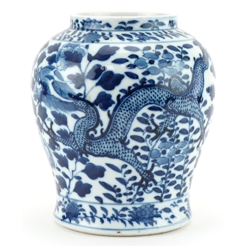 1105 - Chinese porcelain jar hand painted with dragons, character mark to the base, 18cm high