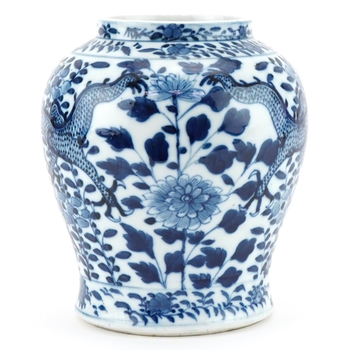 1105 - Chinese porcelain jar hand painted with dragons, character mark to the base, 18cm high