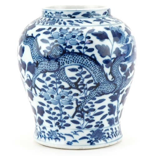 1105 - Chinese porcelain jar hand painted with dragons, character mark to the base, 18cm high