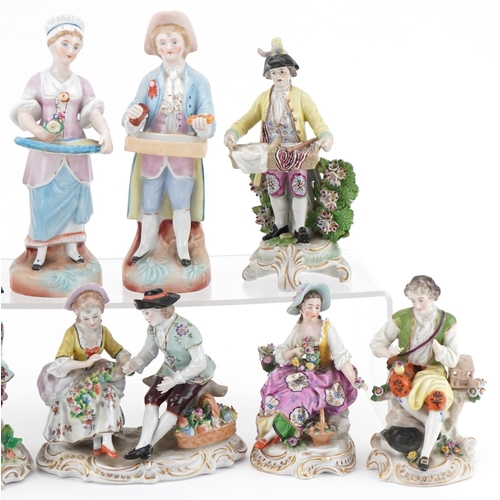 1103 - Ten continental porcelain floral encrusted models including a figure group of The Lovers, the larges... 