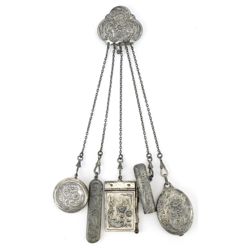 1241 - Early 20th century white metal chatelaine with attachments and a mother of pearl card case, the chat... 