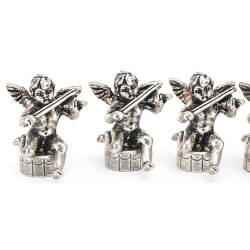 2203 - Set of six white metal place card holders in the form of Putti, 2.5cm high