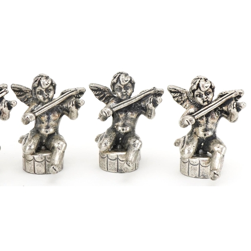 2203 - Set of six white metal place card holders in the form of Putti, 2.5cm high