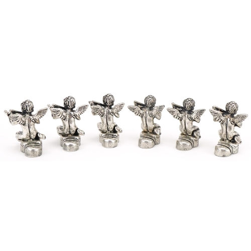 2203 - Set of six white metal place card holders in the form of Putti, 2.5cm high