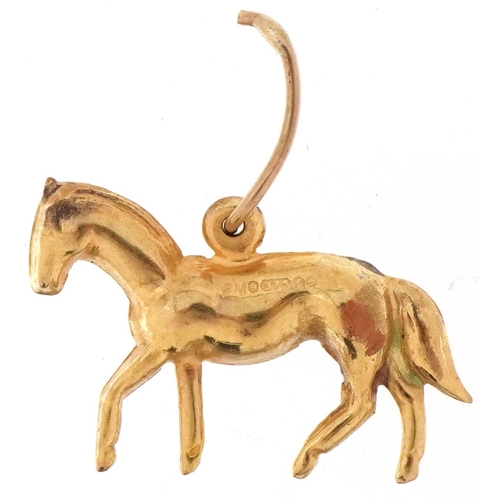 3235 - 9ct gold charm in the form of a horse, 2.1cm in length, 1.3g