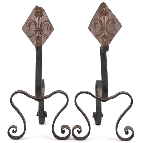 155 - Pair of Arts & Crafts copper and wrought iron Fleur de Lys design firedogs, 45cm high