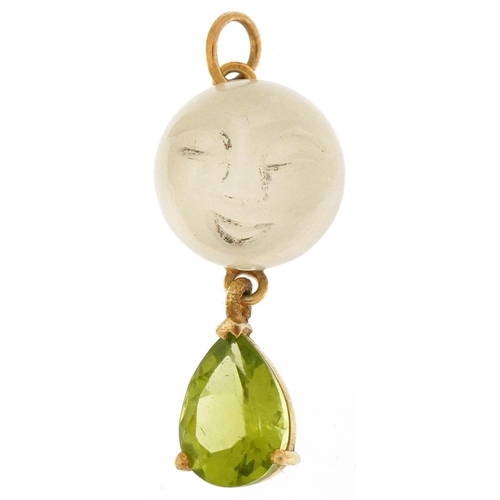 3295 - Unmarked yellow metal pendant with cabochon moonstone carved with a face and green stone teardrop, 3... 