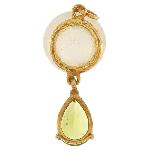 3295 - Unmarked yellow metal pendant with cabochon moonstone carved with a face and green stone teardrop, 3... 