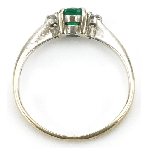 3109 - 18ct white gold emerald and diamond three stone ring, size G, 1.8g