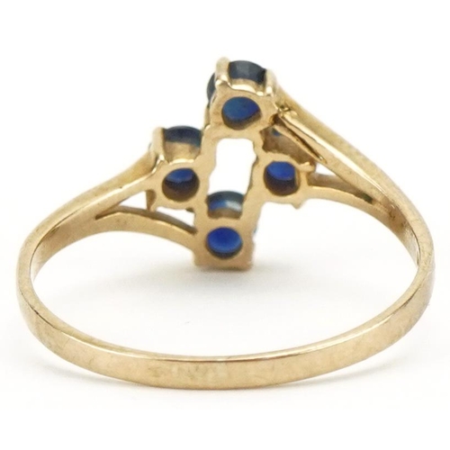 3201 - 9ct gold sapphire four stone ring, size M, 1.3g