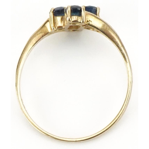 3201 - 9ct gold sapphire four stone ring, size M, 1.3g